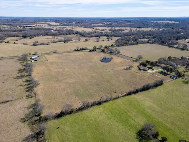 birds eye view of property with a rural view