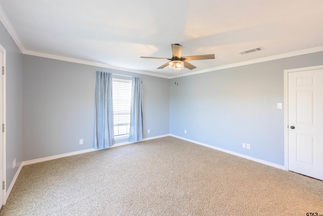 carpeted empty room featuring ceiling fan and crown molding