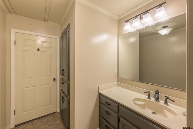 bathroom with tile patterned flooring, crown molding, and vanity