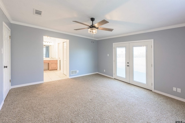 carpeted empty room featuring ornamental molding, ceiling fan, and french doors