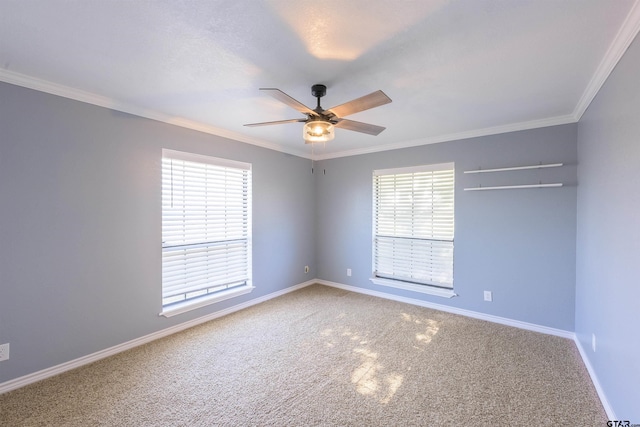 empty room with ceiling fan, ornamental molding, and a healthy amount of sunlight