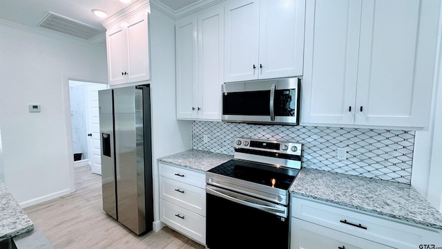 20428 High Point Dr, Flint, TX 75762 - kitchen featuring stainless steel appliances, light wood-type flooring, decorative backsplash, light stone counters, and crown molding