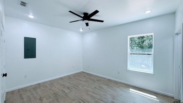 20428 High Point Dr, Flint, TX 75762 - spare room with electric panel, light wood-style flooring, a ceiling fan, and recessed lighting