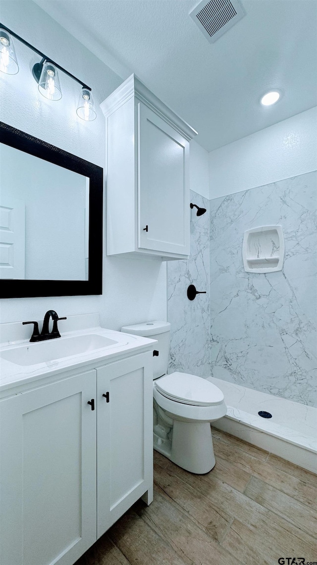 20428 High Point Dr, Flint, TX 75762 - bathroom with vanity, a shower stall, and wood finished floors