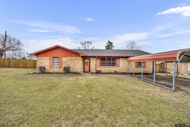 ranch-style home with brick siding, a front lawn, fence, and a detached carport