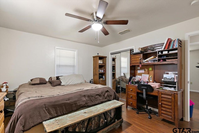 245 Pinecrest St, Rusk, TX 75785 - bedroom with wood finished floors, a desk, ceiling fan, and a closet