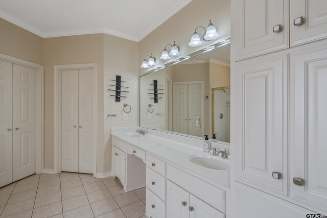 bathroom featuring crown molding, tile patterned flooring, vanity, and a shower with shower door