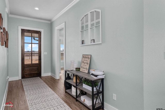 foyer entrance featuring dark hardwood / wood-style flooring and ornamental molding