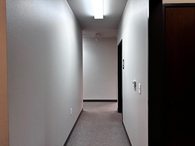 133 E Reagan St, Palestine, TX 75801 - hallway featuring carpet floors and baseboards