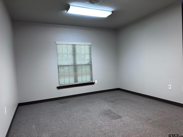 133 E Reagan St, Palestine, TX 75801 - carpeted empty room featuring baseboards