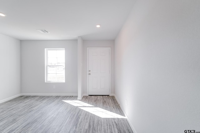 unfurnished room featuring light wood-type flooring