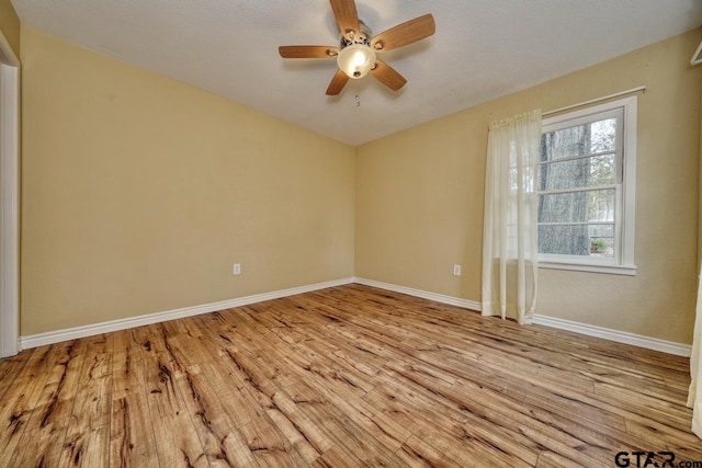 unfurnished room with ceiling fan, light hardwood / wood-style floors, and a textured ceiling