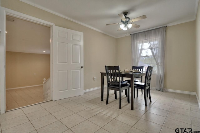 dining space with ceiling fan, crown molding, and light tile patterned flooring