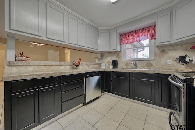 kitchen featuring decorative backsplash, light tile patterned floors, stainless steel appliances, and sink