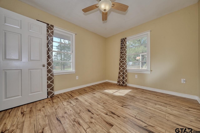 foyer entrance featuring ceiling fan and light wood-type flooring