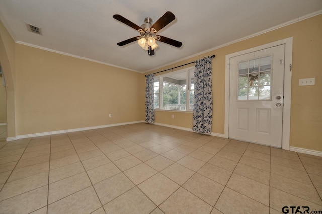 foyer entrance with light tile patterned floors, ceiling fan, and crown molding