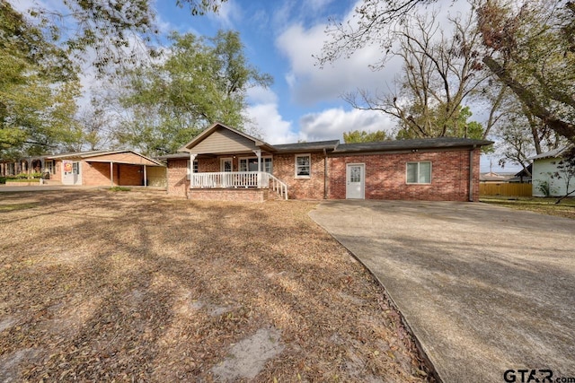 ranch-style house featuring covered porch