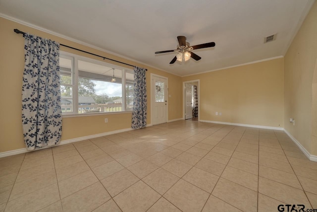 empty room featuring light tile patterned floors, ceiling fan, and crown molding