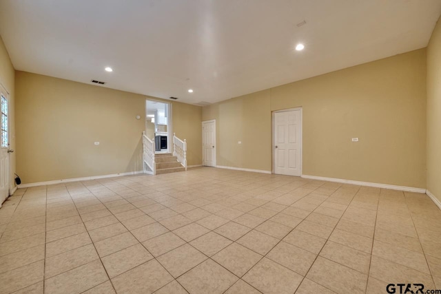 empty room with light tile patterned floors