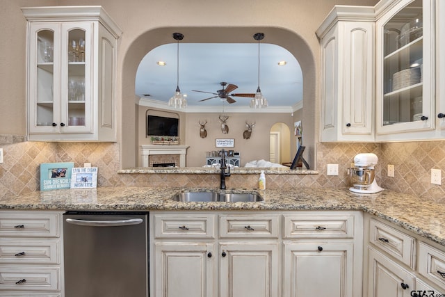 kitchen featuring sink, dishwasher, ceiling fan, hanging light fixtures, and ornamental molding