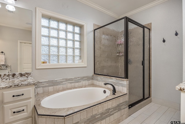 bathroom with crown molding, vanity, and independent shower and bath