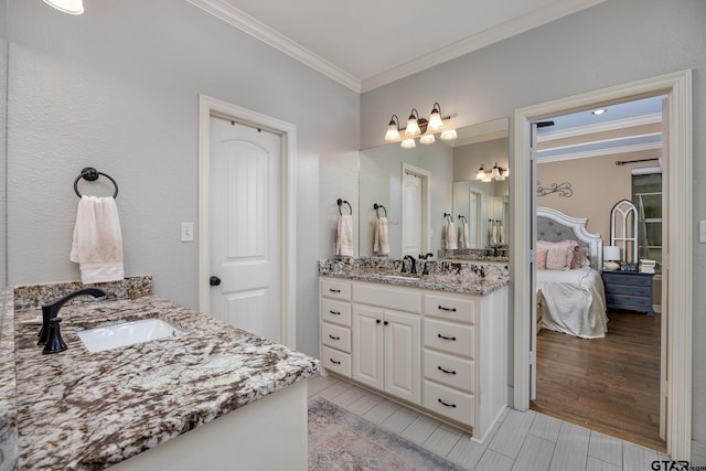 bathroom with vanity and crown molding