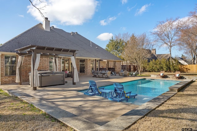 view of pool with a pergola, a hot tub, and a patio