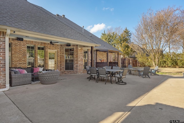 view of patio / terrace featuring an outdoor living space with a fire pit and ceiling fan