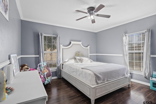 bedroom with crown molding, ceiling fan, and dark wood-type flooring