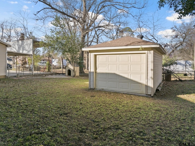 garage with a yard