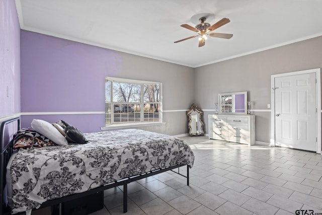 tiled bedroom with ceiling fan and ornamental molding