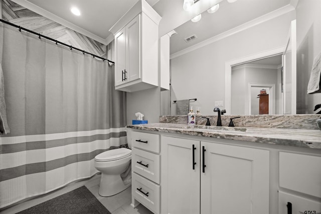 bathroom with ornamental molding, vanity, and toilet