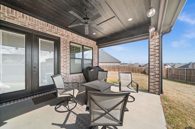 view of patio / terrace featuring ceiling fan