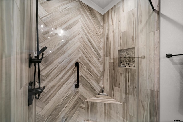 bathroom with a tile shower