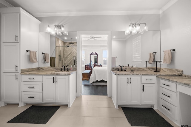 bathroom featuring tile patterned flooring, ornamental molding, vanity, ceiling fan, and a shower with door