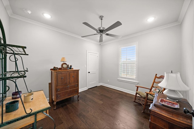 sitting room with ceiling fan, ornamental molding, and dark hardwood / wood-style flooring