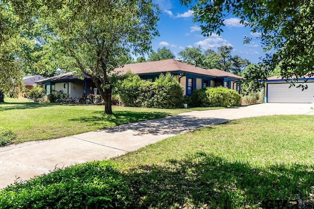 1017 Hilltop Dr, Palestine, TX 75801 - single story home with concrete driveway, a front yard, and a garage