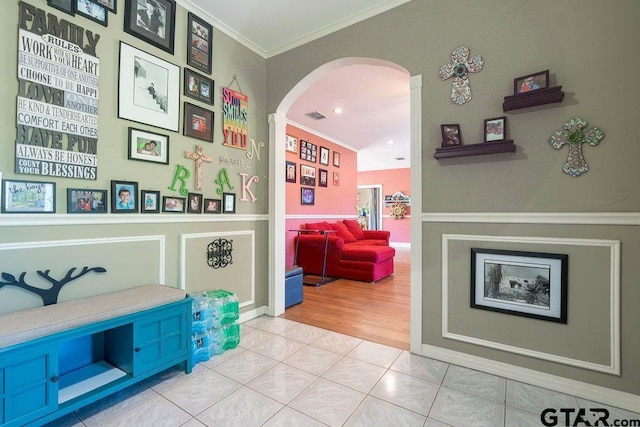 1017 Hilltop Dr, Palestine, TX 75801 - interior space with crown molding, arched walkways, tile patterned floors, and visible vents