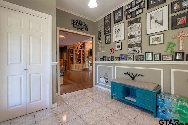 1017 Hilltop Dr, Palestine, TX 75801 - hall featuring ornamental molding and light tile patterned flooring
