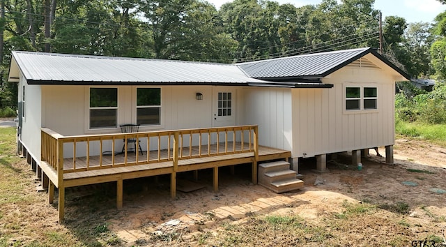 rear view of house with a deck