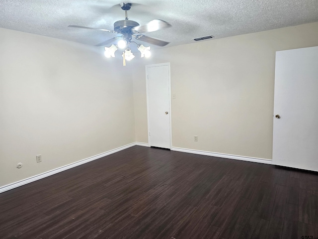 unfurnished room with dark hardwood / wood-style floors, ceiling fan, and a textured ceiling