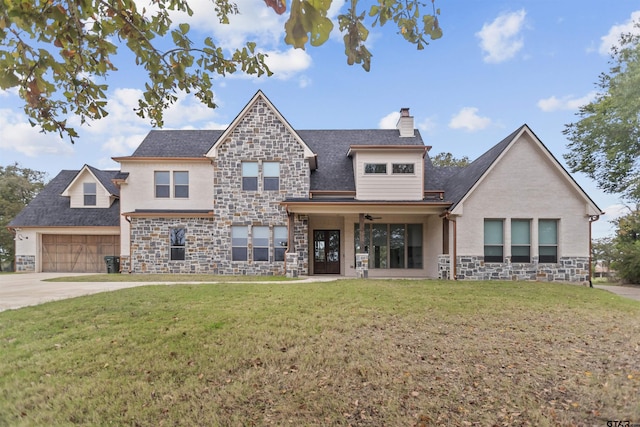 view of front of house featuring a front lawn and a garage