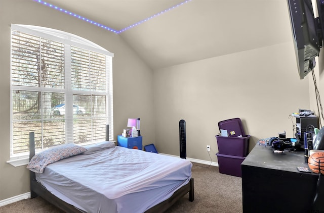 bedroom with carpet flooring and lofted ceiling