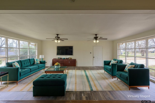 living room featuring ceiling fan and wood-type flooring