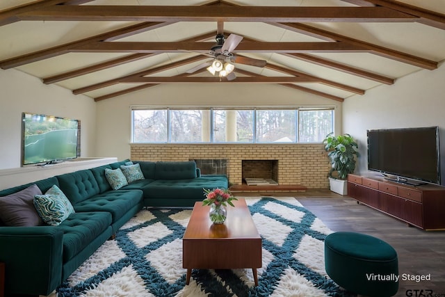 living room with ceiling fan, a healthy amount of sunlight, vaulted ceiling with beams, and dark hardwood / wood-style flooring