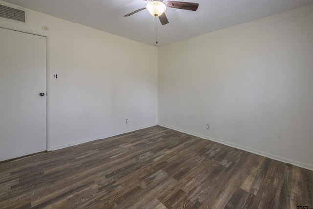 empty room featuring dark wood-type flooring and ceiling fan