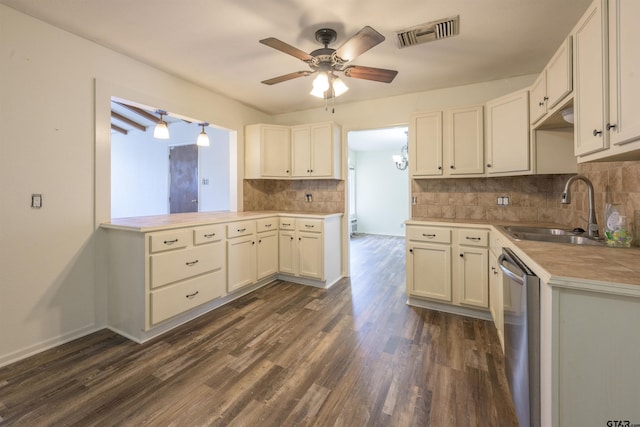 kitchen with white cabinetry, dark hardwood / wood-style flooring, dishwasher, and sink