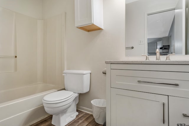 full bathroom with toilet, vanity, hardwood / wood-style floors, and shower / bathtub combination