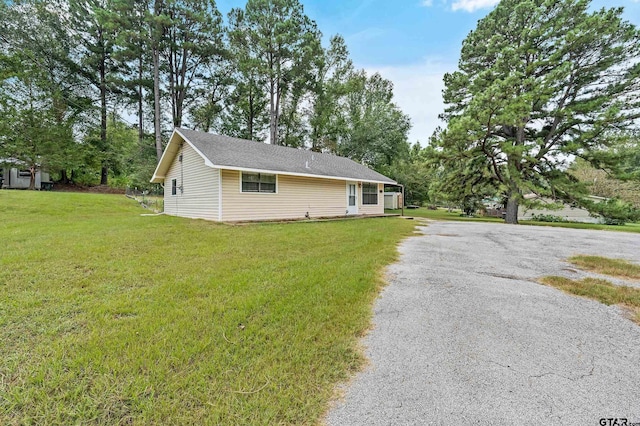 view of home's exterior featuring a yard