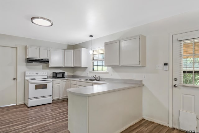 kitchen featuring dark hardwood / wood-style flooring, white cabinets, sink, pendant lighting, and white range with electric stovetop